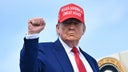 President Trump pumping fist while boarding Air Force One