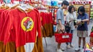 LULING, TEXAS - JUNE 12: Customers shop for apparel inside of the Buc-ee's convenience store on June 12, 2024 in Luling, Texas. The Texas-based convenience store and gas stop, Buc-ee's has become the world's largest convenience store with over 100 gas pumps and a 75,000 square feet store. The newly opened location in Luling is nearly 30 times larger than average convenience stores, and hosts thousands of food and beverage options. (Photo by Brandon Bell/Getty Images) - Fox Business News