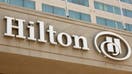 A Hilton logo is displayed outside a Hilton hotel on August 2, 2025, in San Diego, California. - Fox Business News