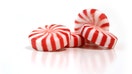 Four peppermint candies isolated on a white reflective background.  Studio set-up. - Fox Business News