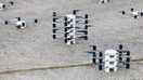 Defense Swarm Technologies' drones on pavement ready to take flight during the day. - Fox Business News