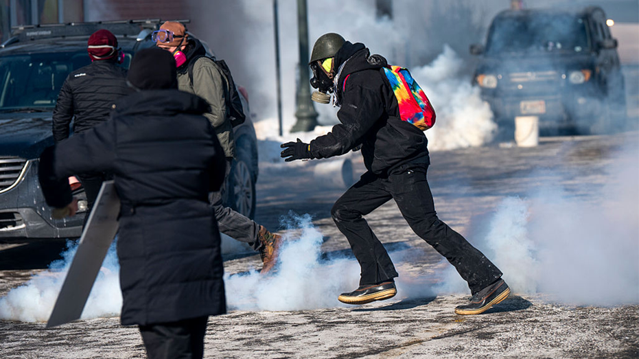 People run away after Minneapolis Police throw tear gas