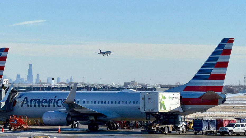 An American Airlines sits at a gate of Chicago O'Hare International Airport.