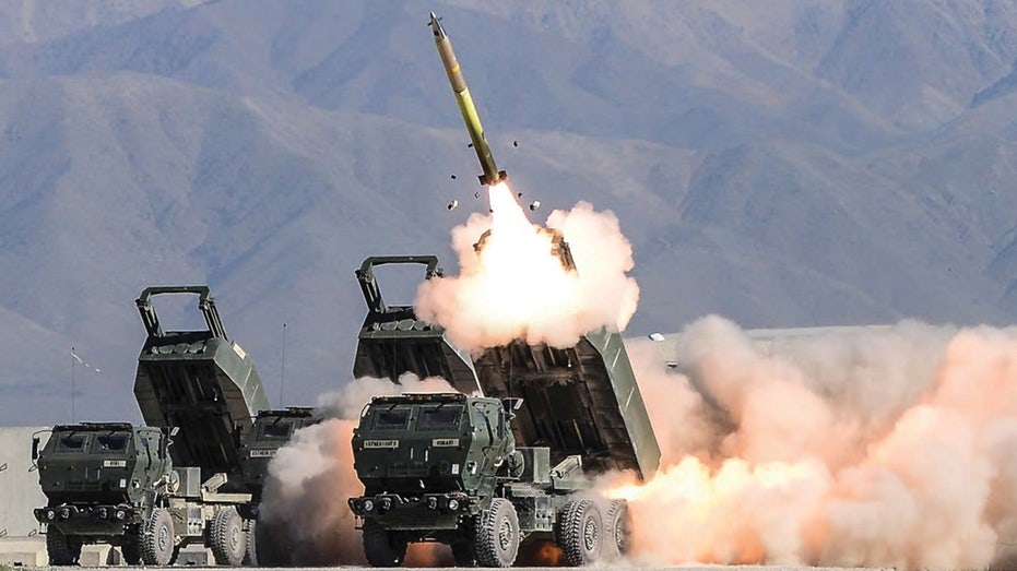 A Lockheed Martin HIMARS launcher firing a missile 