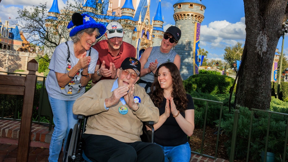 An old man and his family at Disney World