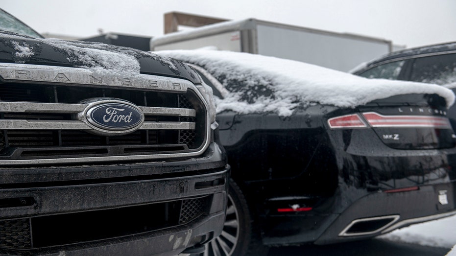 ford vehicles covered in snow