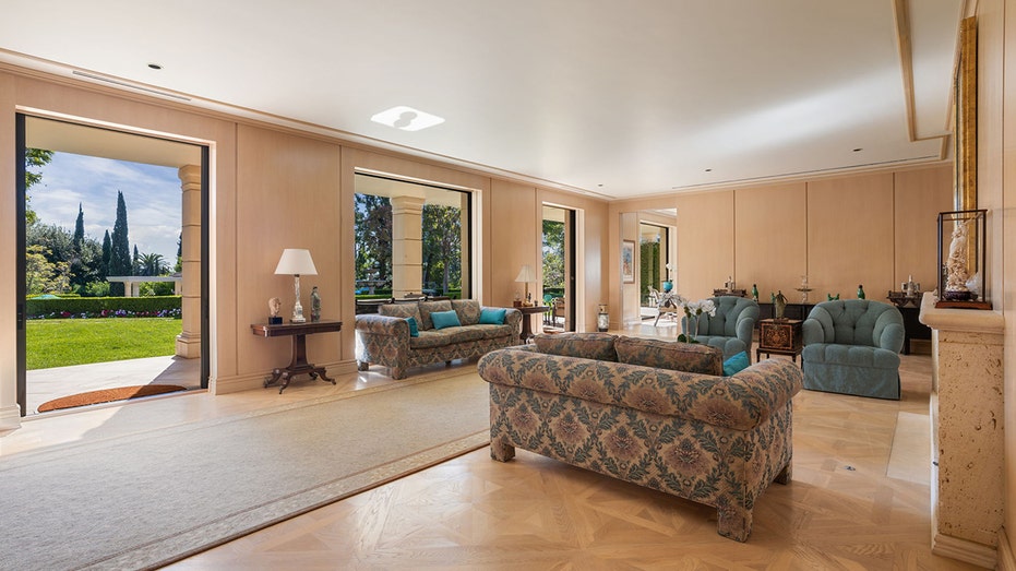 The living room features a fireplace and access to the yard.