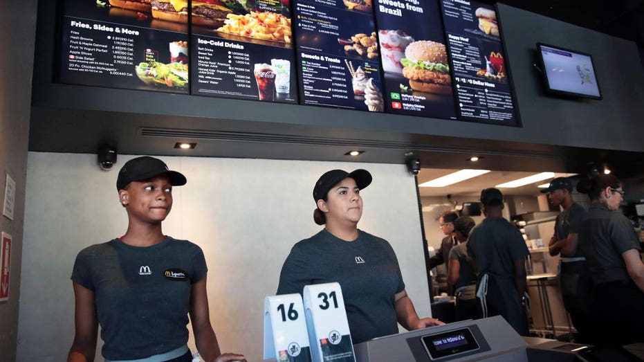 Employees work at a McDonald's restaurant.