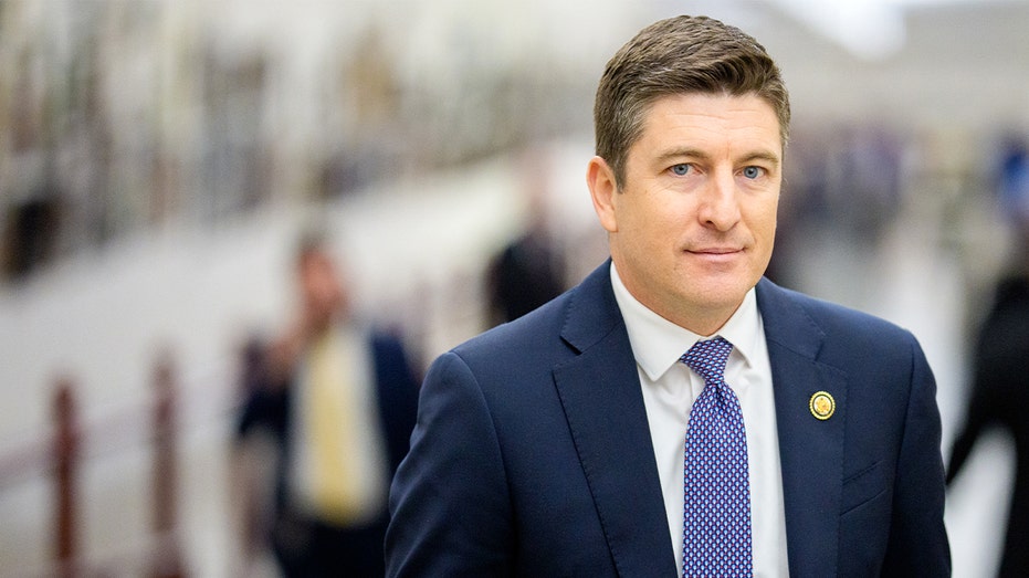 A U.S. congressman walks toward the Capitol.