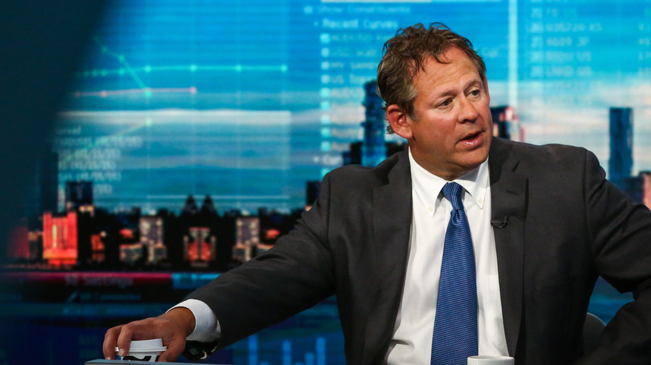 Rick Rieder, CIO of BlackRock, speaks to reporters during a television interview on Bloomberg.