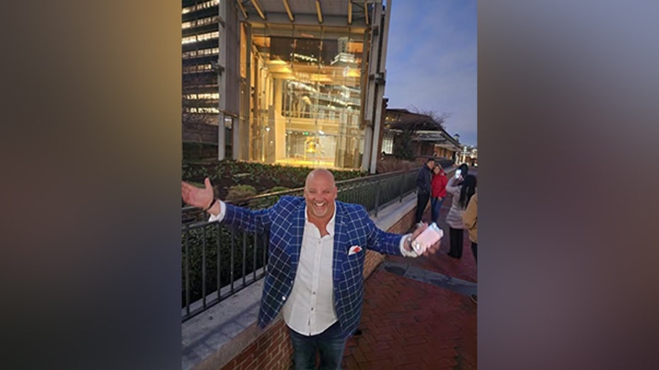 man wearing suit smiling