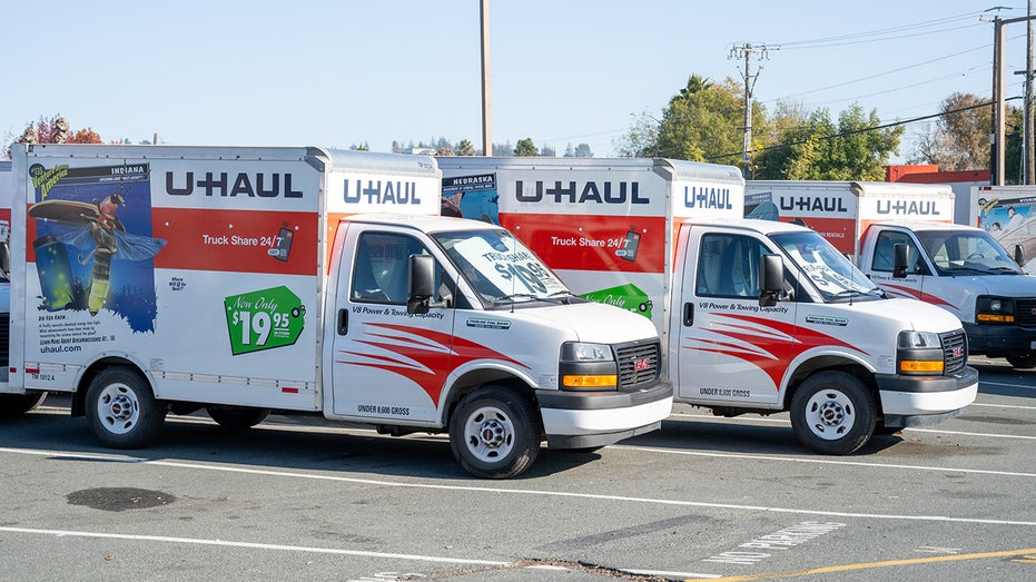 U-Haul trucks lined up in parking lot in California