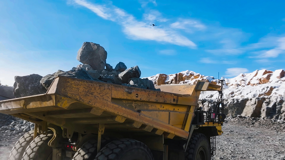 Mine dump truck carrying big rocks