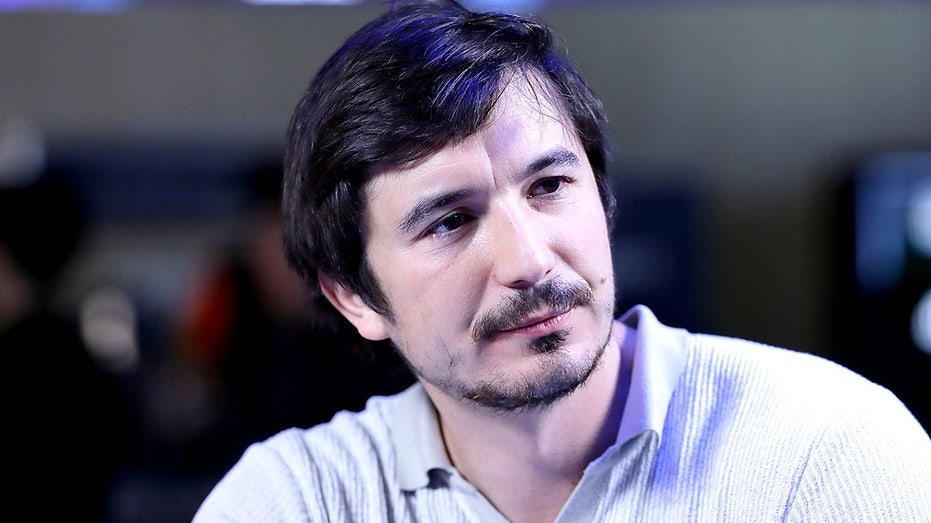 Robinhood CEO Vlad Tenev speaks during a television interview at a cryptocurrency conference.