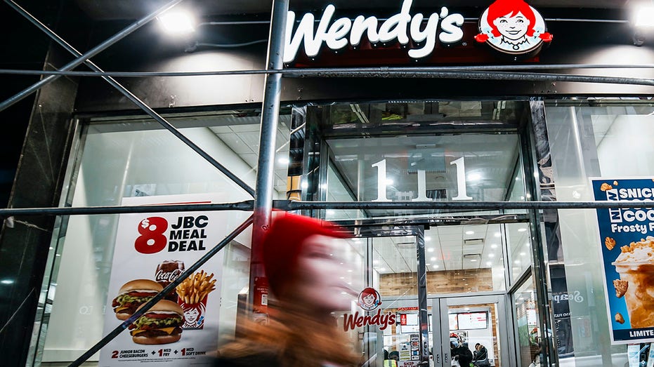 Someone walks near one of the Wendy's restaurants on November in Manhattan.