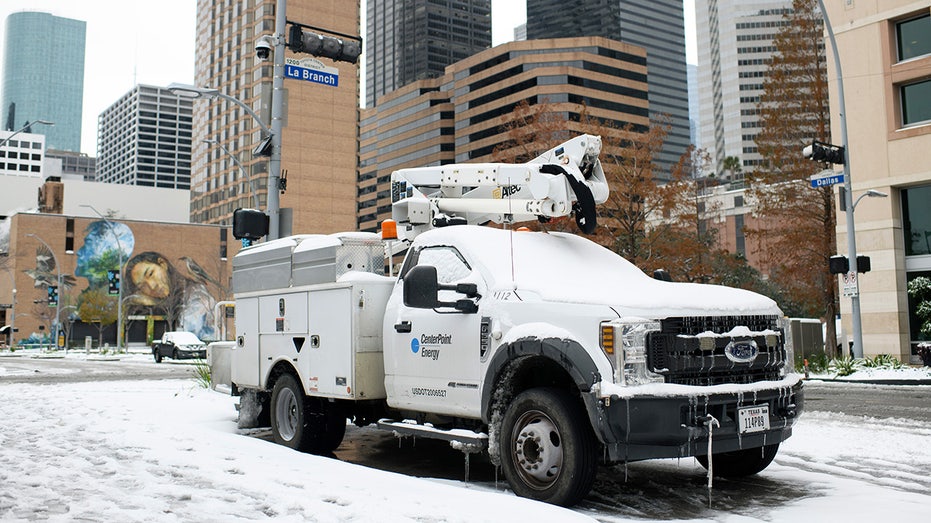 A frozen utility truck during a winter storm