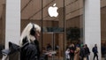 BERLIN, GERMANY - MARCH 25: A young woman, who said she did not mind being photographed, wears headphones and holds a smartphone as she walk past an Apple Store on March 25, 2024 in Berlin, Germany. - Fox News