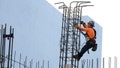 A construction worker helps build a support column using steel rebar during the building of a condo tower on February 10, 2025 in Miami, Florida. - Fox News