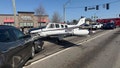 A single-engine Hawker Beechcraft BE-36 sits in the roadway after making an emergency landing and striking vehicles in Gainesville, Georgia, on Feb. 9, 2026. - Fox News