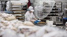 An employee slices cake inside the bakery of a Costco Wholesale Corp. store in Villebon-sur-Yvette, France, on Friday, Nov. 3, 2017.  - Fox Business News