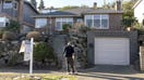A real estate agent and a prospective buyer stand outside of a home during an open house in Seattle, Washington, on Jan. 18, 2026. - Fox Business News