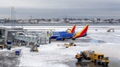 Maintenance crews clear snow from the taxiway at LaGuardia airport, as a major winter storm spreads across a large swath of the United States, in New York City, U.S., January 26, 2026.  REUTERS/David 'Dee' Delgado - Fox Business News