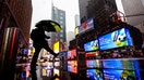 People walk through Times Square as snow falls during a winter storm in New York City, on Feb. 22, 2026.  - Fox Business News