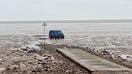 An Amazon delivery van stuck in the mudflats.  - Fox Business News