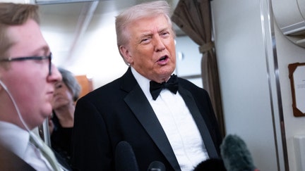 President Donald Trump speaks to members of the media aboard Air Force One as he travels from Washington, DC to West Palm Beach, Florida, on January 31, 2026. - Fox Business News