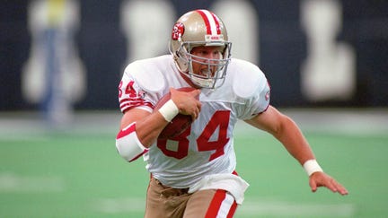 Tight end Brent Jones (84) of the San Francisco 49ers runs with the football after catching a pass during a game against the Indianapolis Colts at the RCA Dome on Oct. 15, 1995 in Indianapolis, Indiana.   - Fox Business News