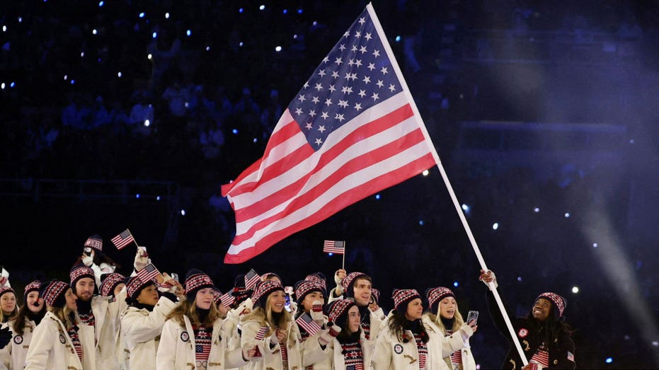 United States flagbearer during the opening ceremony of the 2026 Winter Olympics.