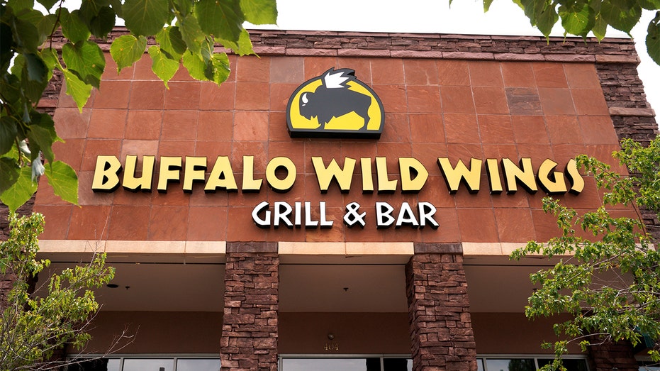 Exterior view of a Buffalo Wild Wings restaurant location in a suburban shopping area.