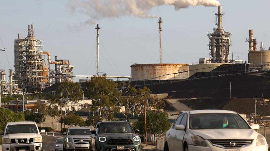 Vehicles pass the Phillips 66 Los Angeles Refinery Wilmington Plant on Nov. 28, 2022 in Wilmington, California.