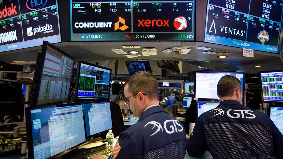 The Conduent logo on a stock exchange trading floor