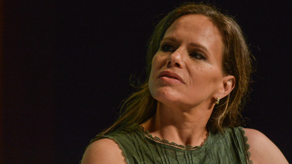close up of woman on stage speaking at panel 