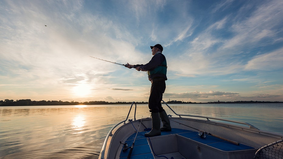Fisherman Casting Out His Line on boat