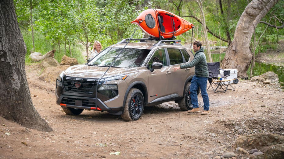 People get in a 2025 Nissan Rogue.