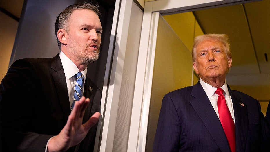 Trump and Jamieson Greer speak aboard Air Force One.