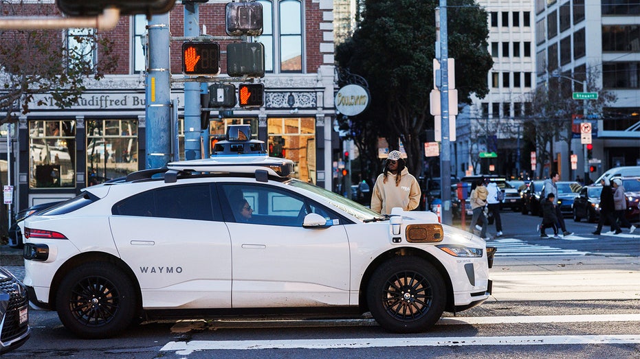 waymo on street corner