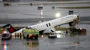 Debris hangs from a damaged Air Canada Express jet that had collided with a ground vehicle at New York's LaGuardia Airport in Queens, New York on March 23, 2026. - Fox Business News