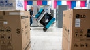 A worker takes a Frigidaire oven to the loading dock of an appliance store in Midwest City, Oklahoma, on Nov. 24, 2025. - Fox Business News