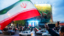 Iranians waving flags in support of the Iranian regime. - Fox Business News