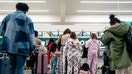 A traveler in a pajama-style onesie in a Frontier Airlines check-in line at Hartsfield-Jackson Atlanta International Airport in Atlanta, Georgia, on Dec. 23, 2025. - Fox Business News