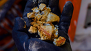 Worker holding a soil sample of rare earth minerals - Fox Business News