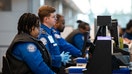 Travelers and staff walk through Ronald Reagan Washington National Airport in Arlington, Virginia, on March 13, 2025. Union leaders in Atlanta called on Congress to end the Department of Homeland Security shutdown amid the financial stress for TSA workers, who are still showing up to work without being paid.  - Fox Business News