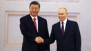 Russian President Vladimir Putin shaking hands with Chinese President Xi Jinping during a meeting in Moscow, Russia - Fox Business News