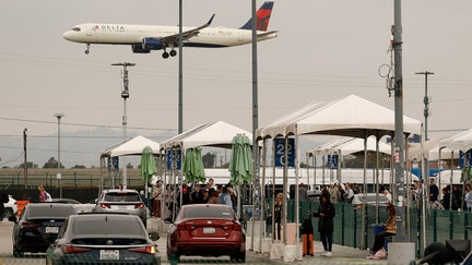 Travelers wait for rideshare pickups at the LAX-it rideshare pickup location at Los Angeles International Airport on March 10, 2026 in Los Angeles, California.  - Fox Business News