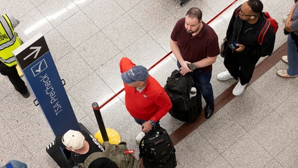 Passengers wait in lines as they maneuver toward a Transportation Security Administration (TSA) checkpoint at Hartsfield-Jackson Atlanta International Airport in Atlanta, March 23, 2026. - Fox Business News