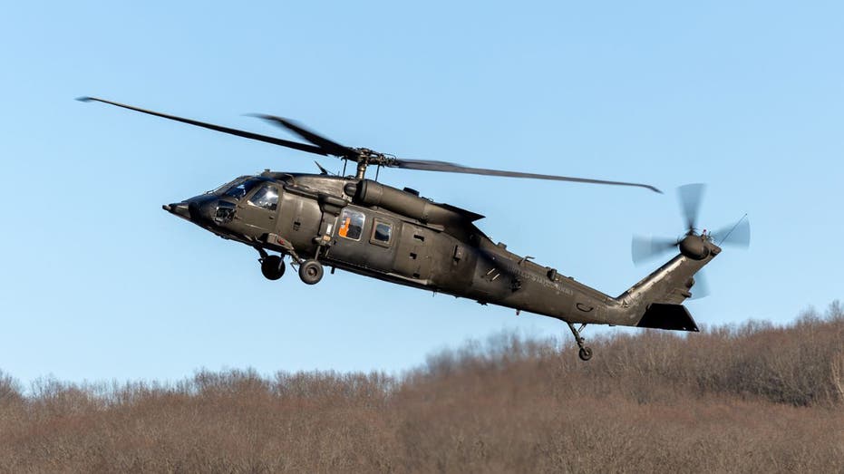 A UH-60 Black Hawk helicopter equipped with advanced autonomy systems flies during testing.