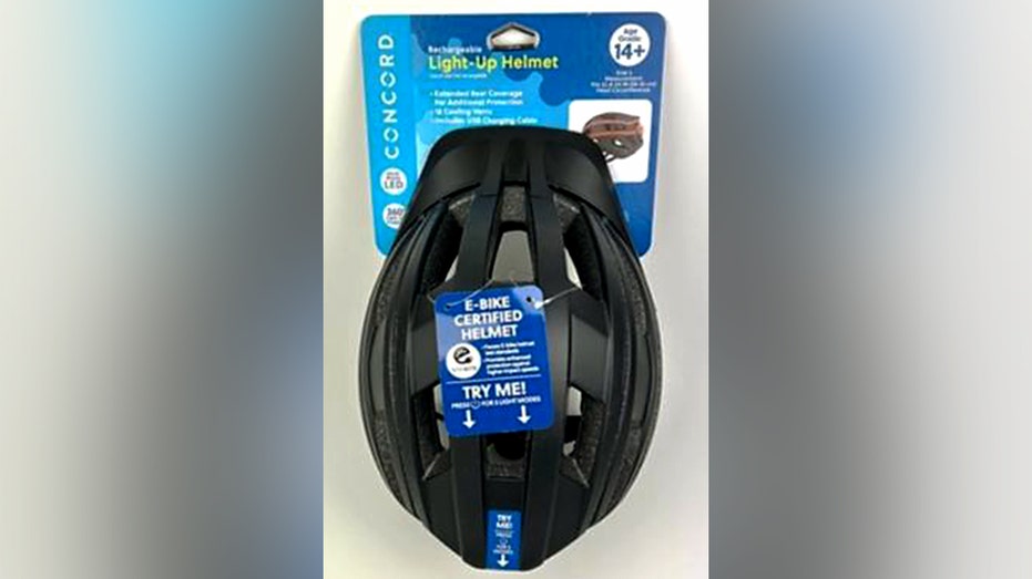 A black helmet is packaged with a tag that reads "E-Bike Certified Helmet."